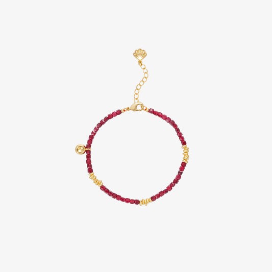 TIKOO original natural red garnet bead bracelet with 925 sterling silver and thick 18K gold plating, white background.