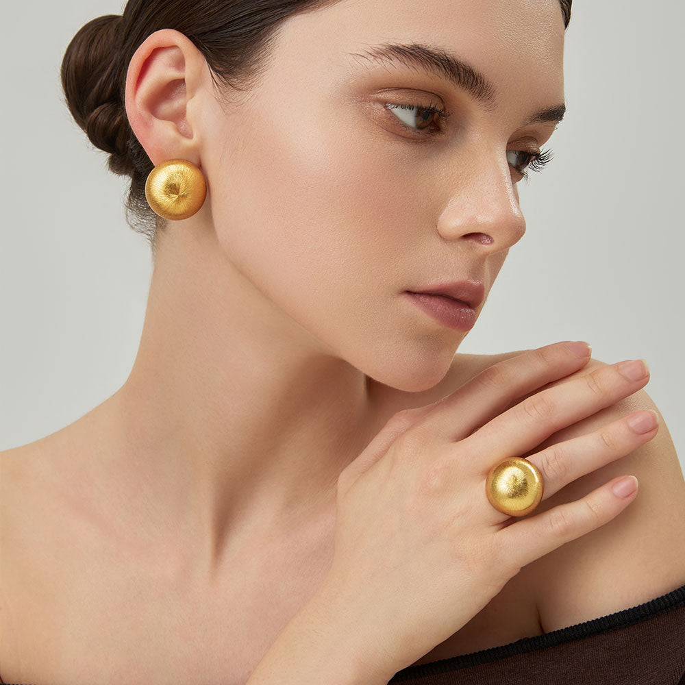 TIKOO brushed texture gold ring worn by model, perfect for minimalist statement jewelry looks.