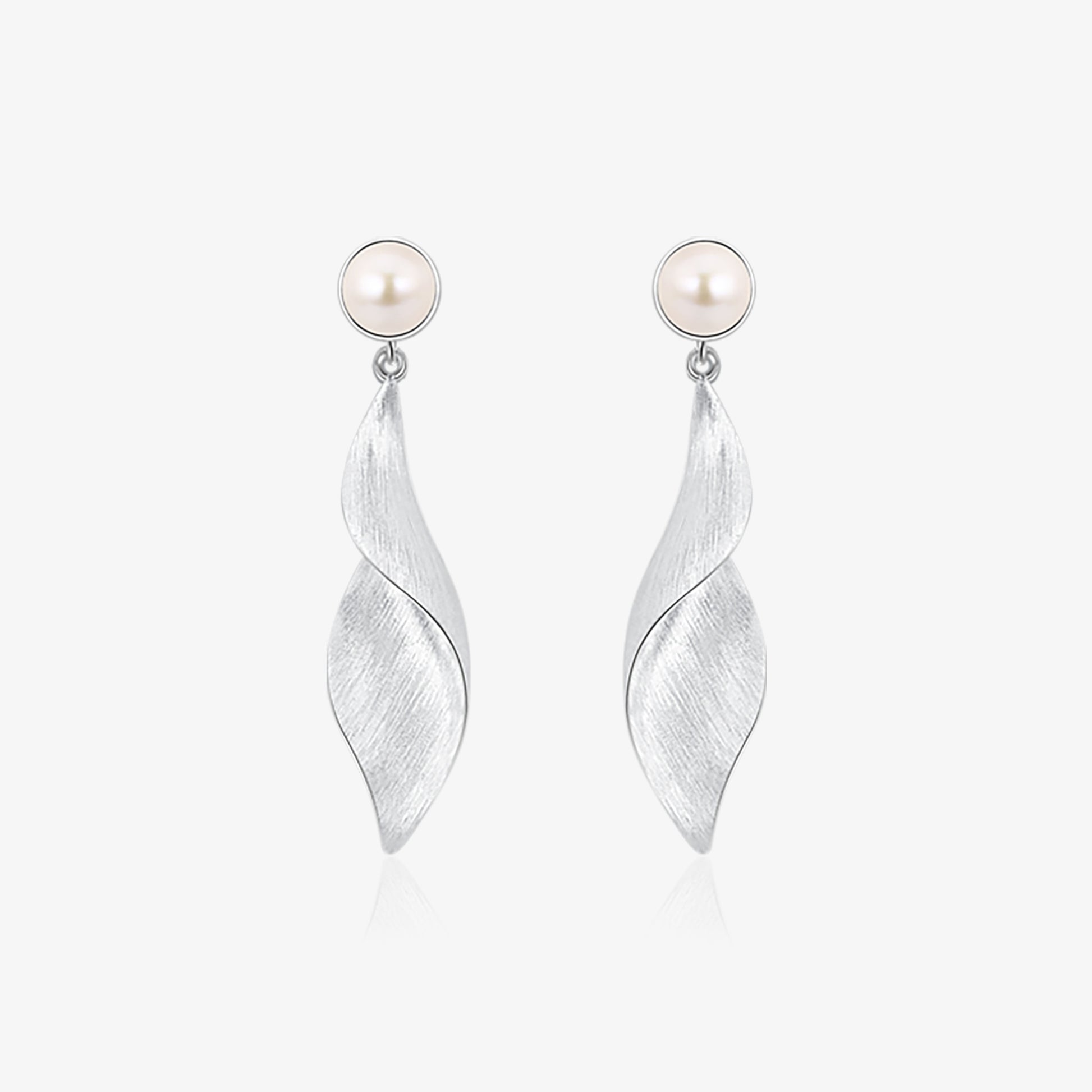 TIKOO original design platinum plated natural pearl twisted leaf drop earrings on white background.