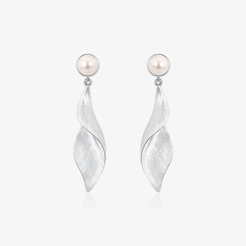 TIKOO original design platinum plated natural pearl twisted leaf drop earrings on white background.