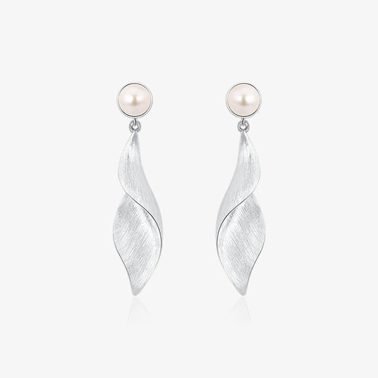 TIKOO original design platinum plated natural pearl twisted leaf drop earrings on white background.