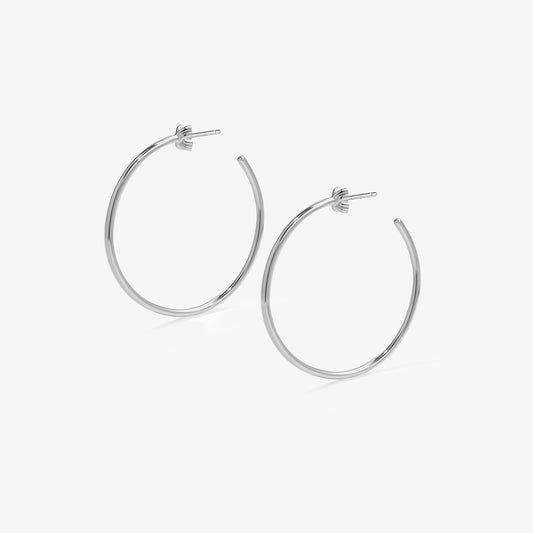 TIKOO 925 sterling silver large hoop earrings with thick white gold plating on a white background.