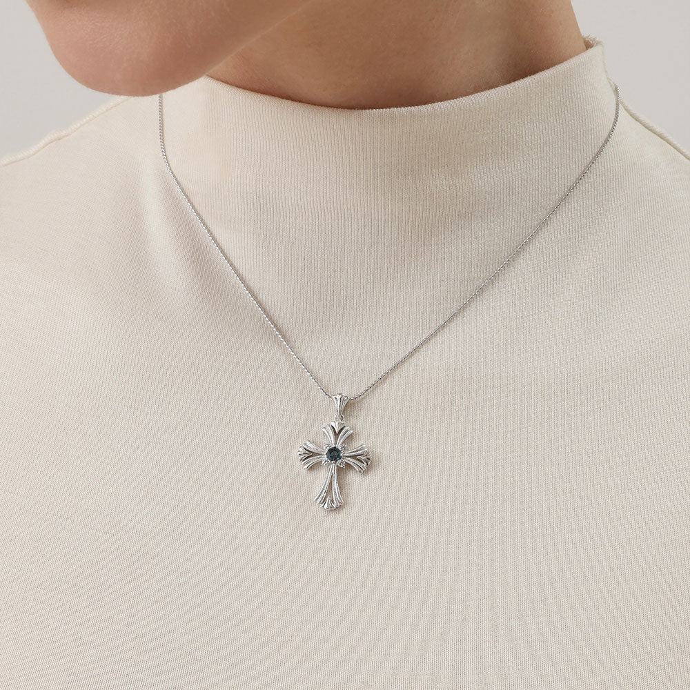 Close-up detail of TIKOO cross necklace showing thick platinum plating and VVS Moissanite sparkle.