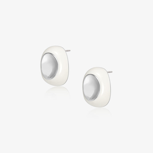 A pair of TIKOO original design modern oval-shaped stud earrings featuring glossy white cold enamel and platinum plated eco-copper finish on a white background.