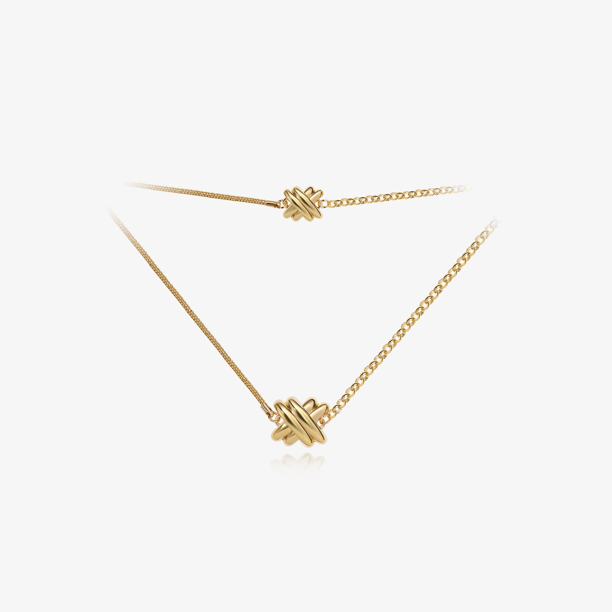 TIKOO original design long knot necklace in 18K gold plated eco-friendly brass with asymmetric chain detail.