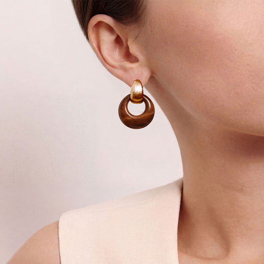 Close-up of a model wearing TIKOO tiger eye stone hoop earrings, showcasing the quiet luxury and old money style.