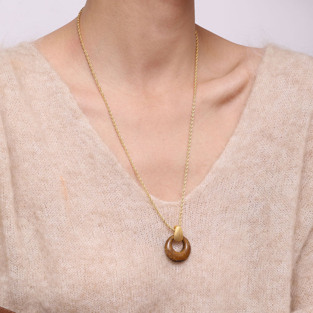 Detailed view of the 18K thick gold plating and natural brown gemstone texture of the TIKOO pendant necklace.