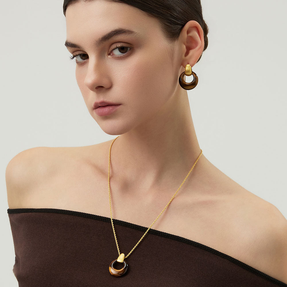 Detailed view of the 18K thick gold plating and natural brown gemstone texture of the TIKOO pendant necklace.