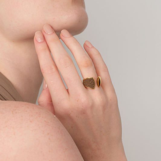 Model wearing TIKOO tiger's eye and genuine leather statement ring, showcasing the adjustable open band design.