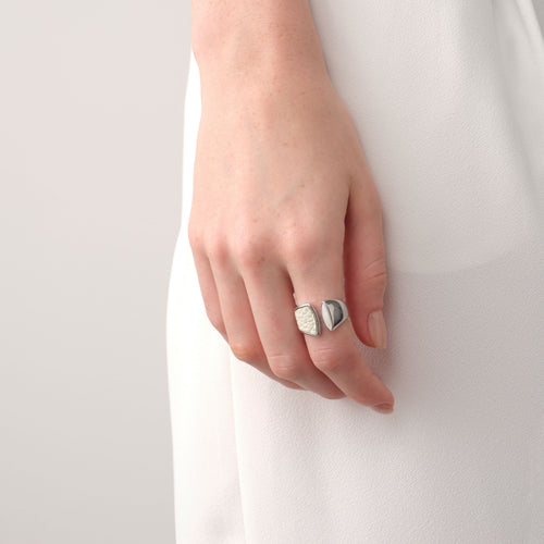 Model wearing the TIKOO white tiger's eye and leather ring, showcasing a clean, sophisticated jewelry look.