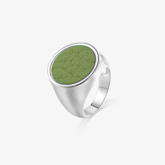 TIKOO original circular signet ring featuring sage green pebbled leather inlay and thick white gold plating.