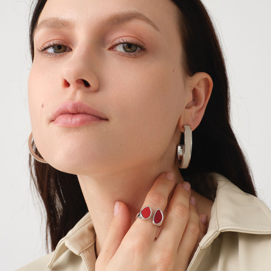 Fashion model wearing TIKOO large white leather hoop earrings, showcasing the clean girl aesthetic and minimalist jewelry trend.