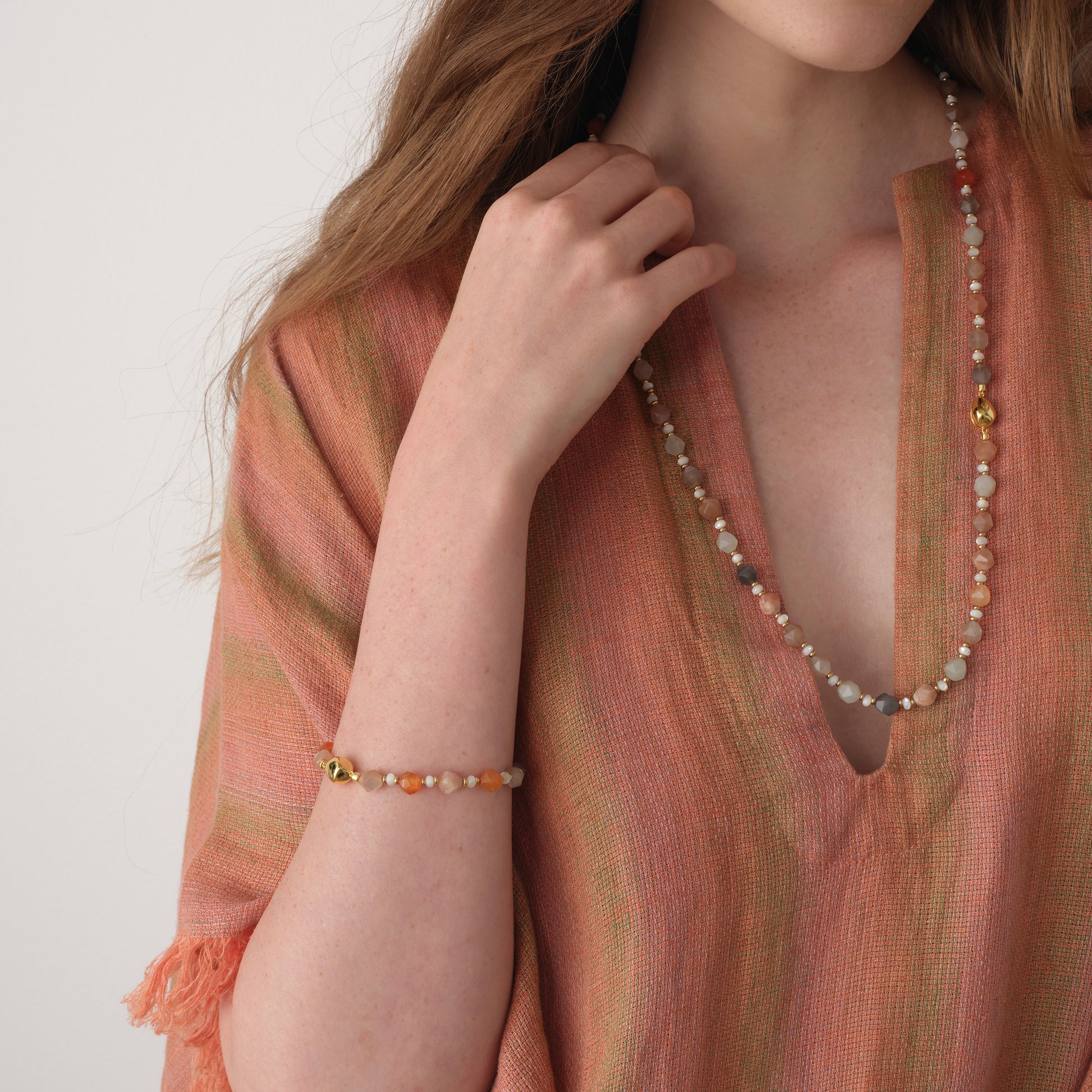 Model styling the TIKOO moonstone bracelet and matching long necklace, highlighting the cohesive look of the natural stone collection.