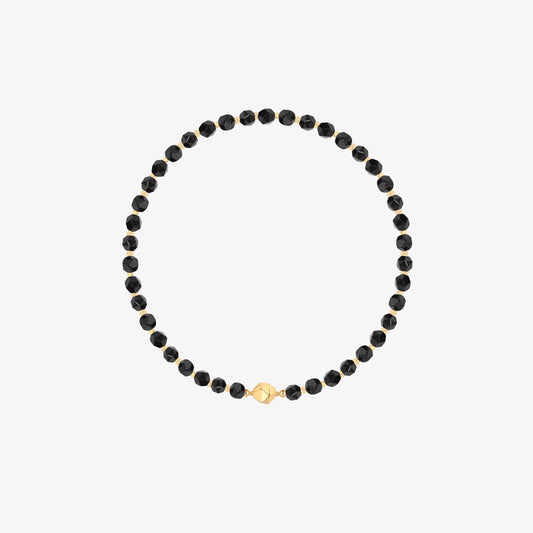 Professional product shot of TIKOO original design black onyx beaded necklace with 18k gold plated geometric accents on a white background.