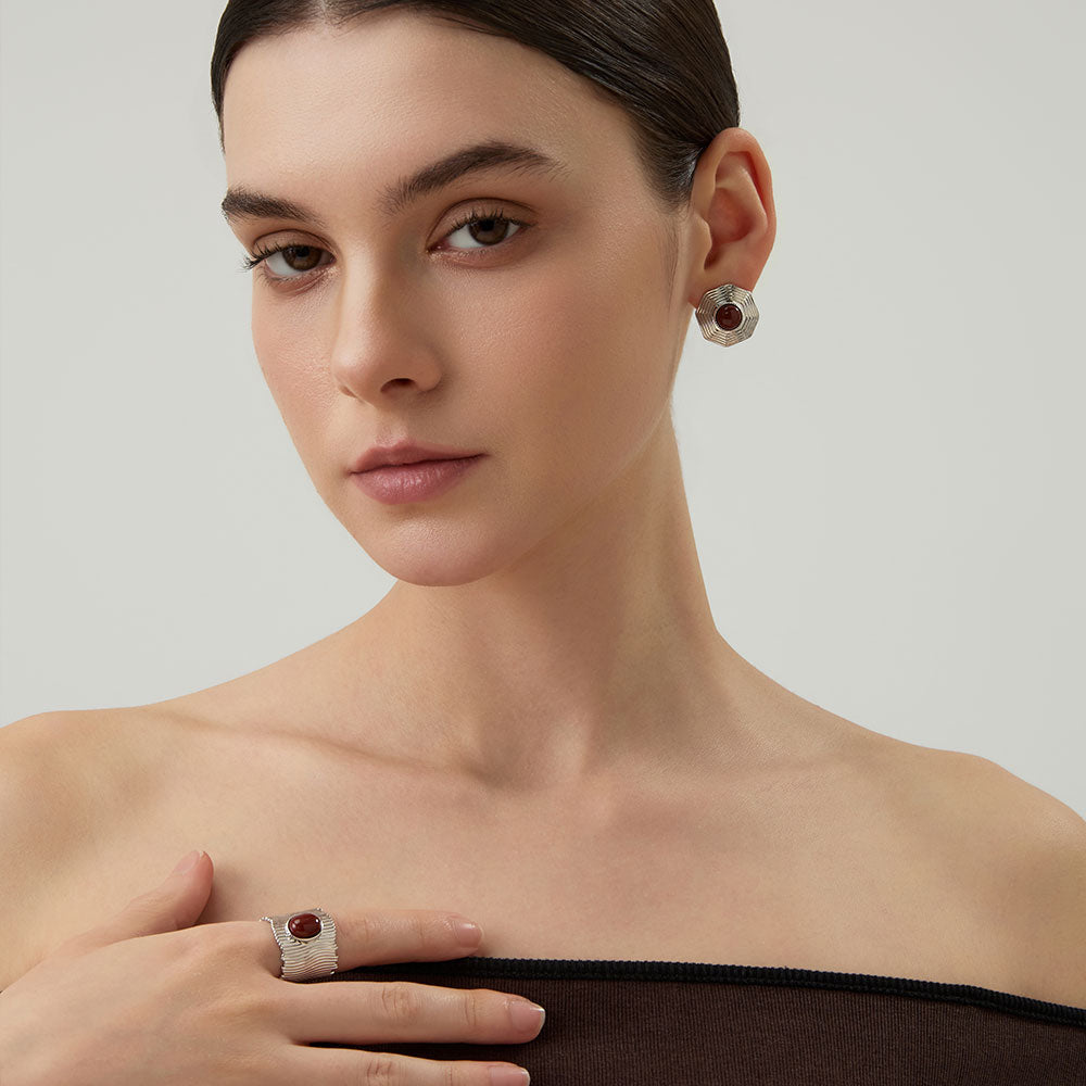 Lifestyle shot of a woman wearing the TIKOO wide band smoky quartz ring, highlighting earthy jewelry style.