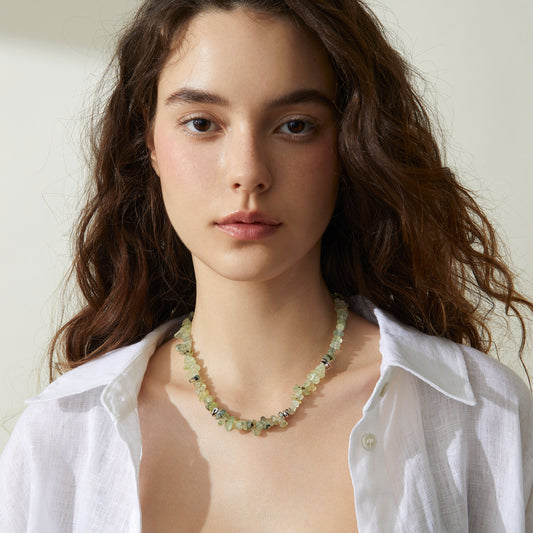 Professional model showcasing the TIKOO prehnite beaded necklace, styled with a minimalist white linen shirt for a modern everyday look.