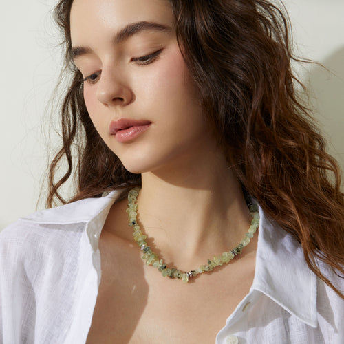 Professional model showcasing the TIKOO prehnite beaded necklace, styled with a minimalist white linen shirt for a modern everyday look.