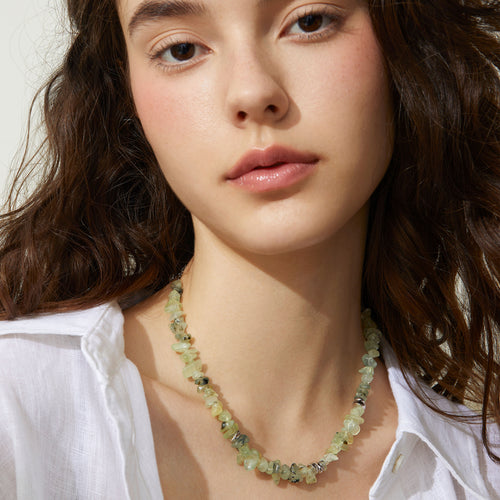 Professional model showcasing the TIKOO prehnite beaded necklace, styled with a minimalist white linen shirt for a modern everyday look.