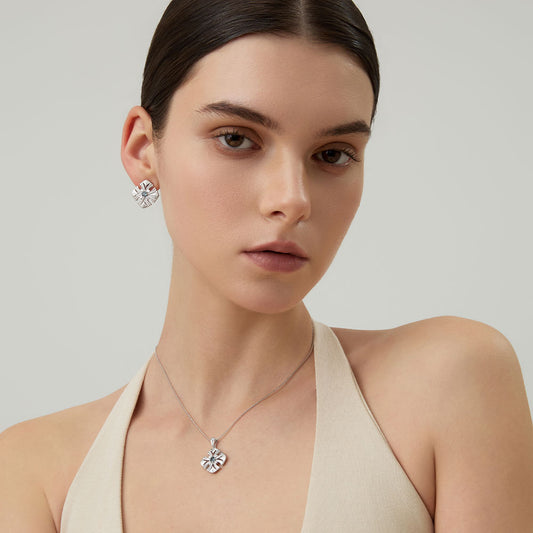A model wearing the TIKOO natural topaz necklace and matching earrings to showcase the luxury jewelry set.