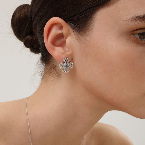 Side view of the TIKOO vintage floral studs, highlighting the intricate 18K platinum plated craftsmanship.
