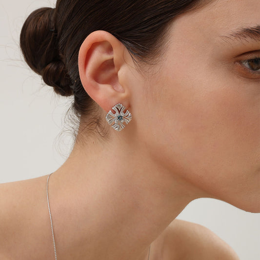 Side view of the TIKOO vintage floral studs, highlighting the intricate 18K platinum plated craftsmanship.