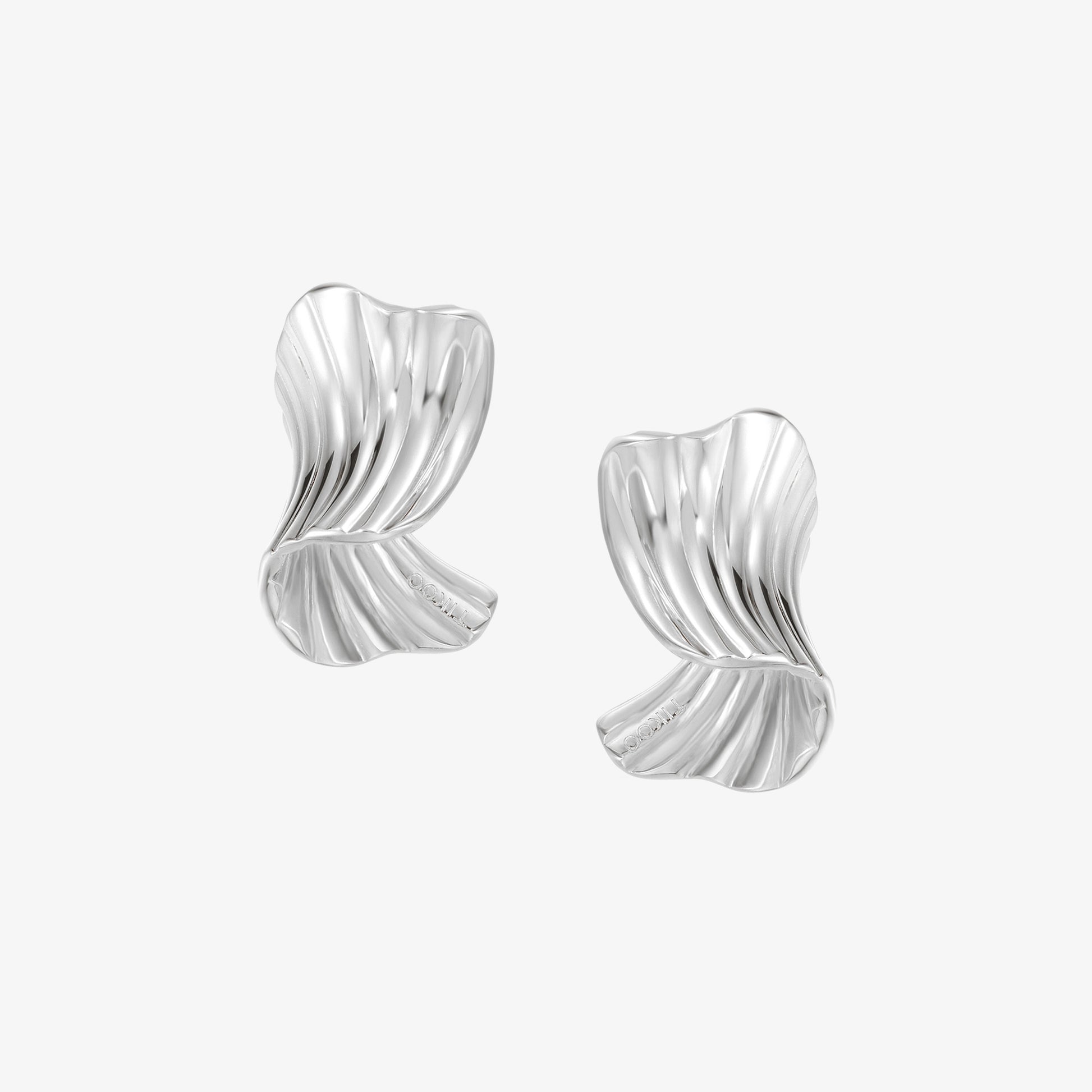 TIKOO original design sculptural pleated ribbon earrings in heavy white gold plating, front view on white background.