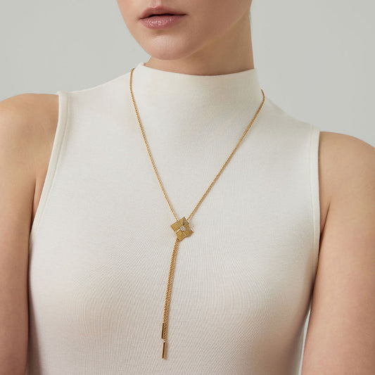 Close-up of the D color VVS Moissanite center stone on the TIKOO architectural gold pendant.