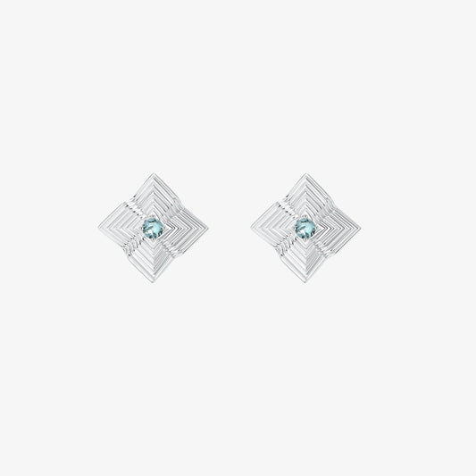 High-quality product photography of TIKOO blue gemstone earrings showing intricate geometric textures.